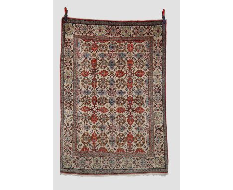 Qum rug, south central Persia, circa 1930s-40s, 6ft. 1in. X 4ft. 3in. 1.86m. X 1.30m. Overall even wear. Ivory field with all