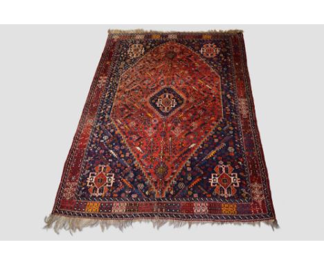 Fayli Lor carpet, Shiraz area, Fars, south west Persia, circa 1940s-50s, 10ft. 5in. X 7ft. 4in. 3.17m. X 2.24m. Light red dia