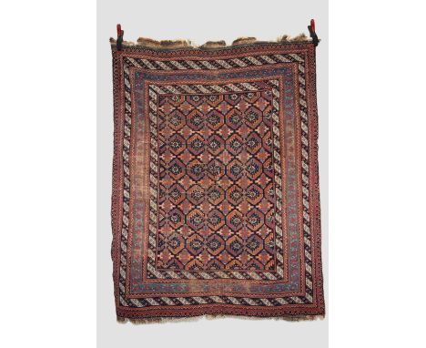 Afshar rug, Kerman area, south east Persia, circa 1920s, 5ft. 9in. X 4ft. 4in. 1.75m. X 1.32m. Overall wear with losses to en