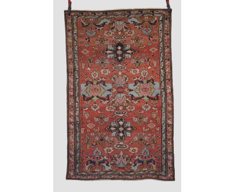 Hamadan rug, north west Persia, circa 1920s, 6ft. 3in. X 3ft. 11in. 1.91m. X 1.20m. Overall wear with corrosion to dark brown