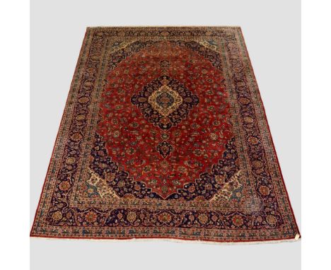 Kashan carpet, west Persia, circa 1950s, 14ft. 5in. X 9ft. 10in. 4.40m. X 3m. Slight fading to the top end; two small darker 