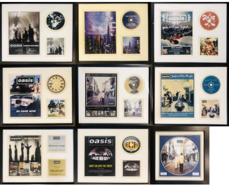 OASIS. Nine framed displays, typically to feature an Oasis CD with artwork and a promotional item.