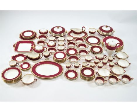 An extensive Wedgwood porcelain dinner service in the Vlander pattern, with shagreen style mulberry coloured banding edged in