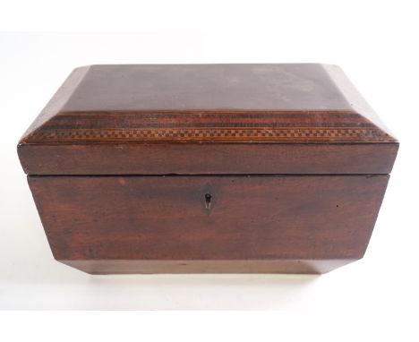 A George IV tea caddy in mahogany, of sarcophagus form, the lid edged with exotic wood banding and chequering over a plain bo
