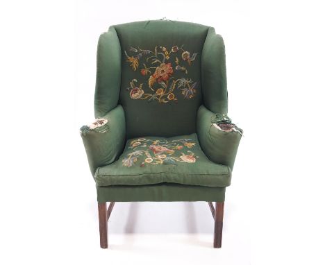 A Gainsborough style wingback armchair on mahogany legs, 122cm high, 90cm wide, 62cm deep