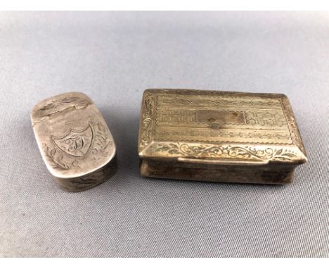 A small hinged lid silver snuff (?) box with bright cut decoration, Birmingham 1798, 3cm long, 7grams, and a white metal engi