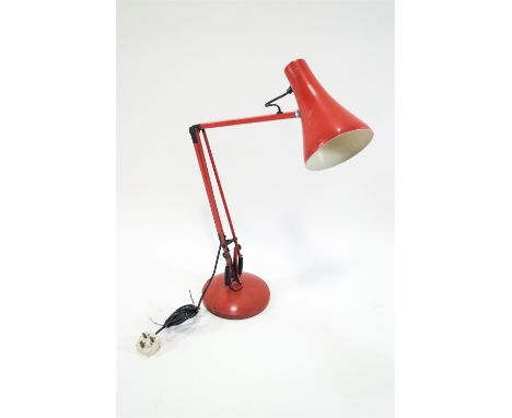A red anglepoise lamp, 82cm high