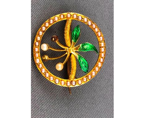 A yellow metal brooch of abstract design set with seed pearls and finished with green enamel. Pin and C catch. Untested - sta