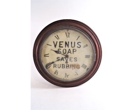 A mahogany cased round wall clock, the painted dial advertising "Venus Soap Saves Rubbing", 40.5cm dimeter