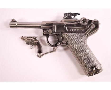 A cast metal replica Luger cigarette lighter, 22cm long and a small pistol key ring