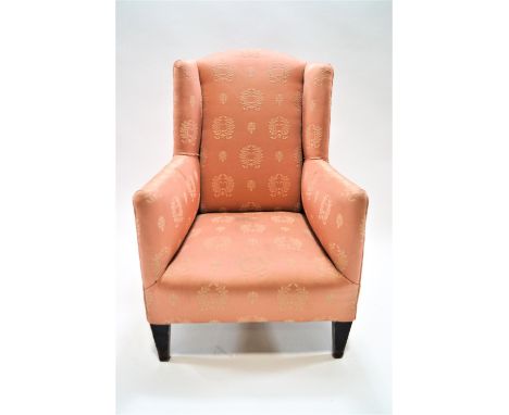 A child's wing back armchair, on square tapering mahogany legs, 79cm high,  48cm wide,  54cm deep