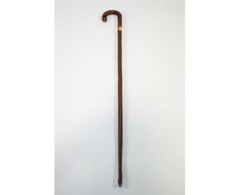 A walking stick with gold band and a walking cane with turned ivory handle, 89cm high