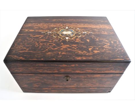 A coromandel travelling case of plain rectangular form, by Fisher, 188 Strand, the top inlaid with a strapwork motif in brass