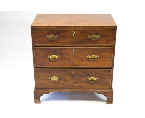 A nineteenth century chest of three drawers, with boxwood stringing on bracket feet, 86cm high, 84cm wide, 48cm deep