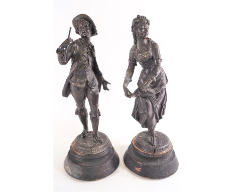 A pair of Spelter figures on wooden bases being a dancing girl and a boy with a miniature bugle, 34cm high