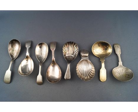 A plated fluted shell bowl caddy spoon and seven others
