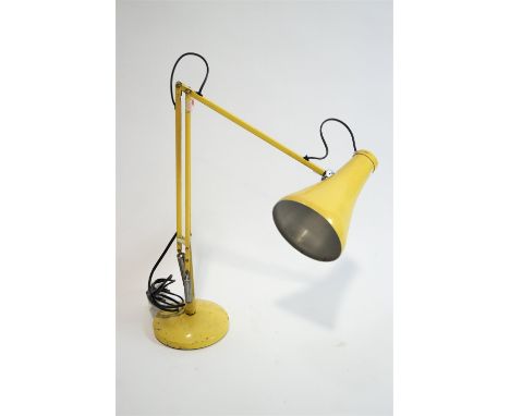 A yellow anglepoise lamp, 85cm high