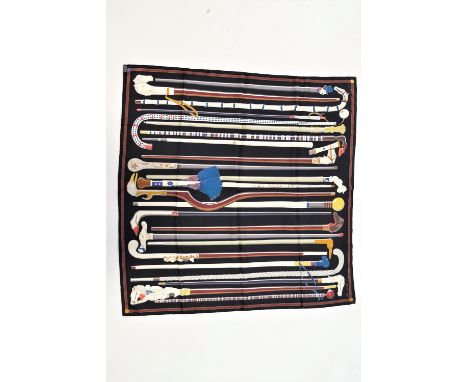 A Hermes silk scarf printed with various riding crops, 87 cm square