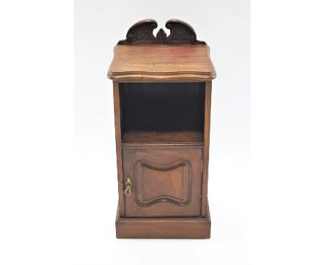 A 19th century mahogany pot cupboard,  with shaped back above an open shelf above a panelled door, on plinth base, 90cm high,