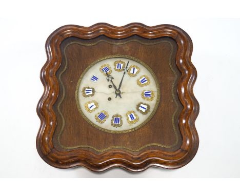 A nineteenth century French style wall clock, the round alabaster face with enamel Roman numerals with in shaped oak case, 62