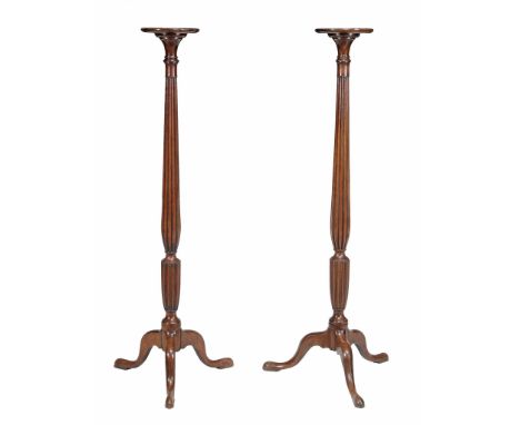 A pair of mahogany torcheres , circa 1770 and later  A pair of mahogany torcheres  , circa 1770 and later, each with a dish t