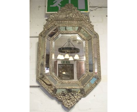 WALL MIRROR, 19th century Dutch repousse silvered metal octagonal bevelled with crest and cushion marginal plates, 109cm H x 
