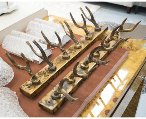 COAT HOOKS, a pair, in the form of antlers in a bronzed metal finish, 51cm L. (2)