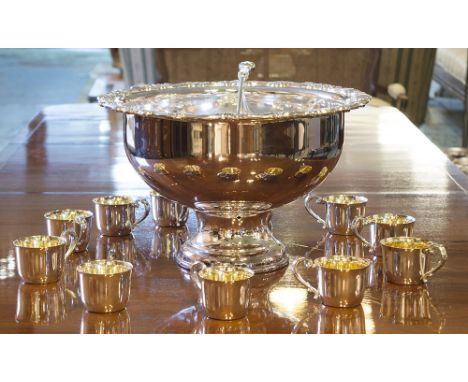 PUNCH BOWL AND CUPS, silver plated circular footed scroll rimmed together with twelve conforming silver gilt punch cups and l