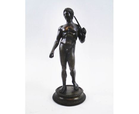 AFTER THE ANTIQUE ROMAN SCHOOL, bronze of a young man with staff (possibly Augustus), 27.5cm H.