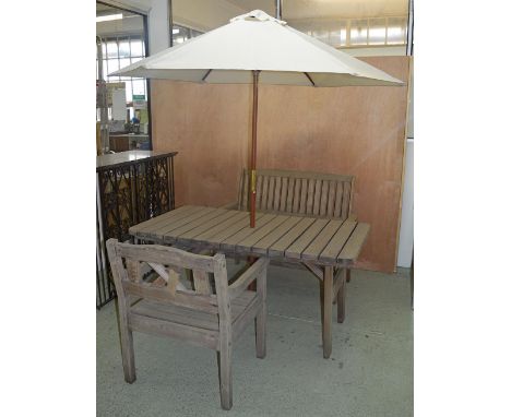 GARDEN FURNITURE, rectangular table weathered slatted with parasol, conforming armchair and a bench, table 150cm x 80cm x 73c