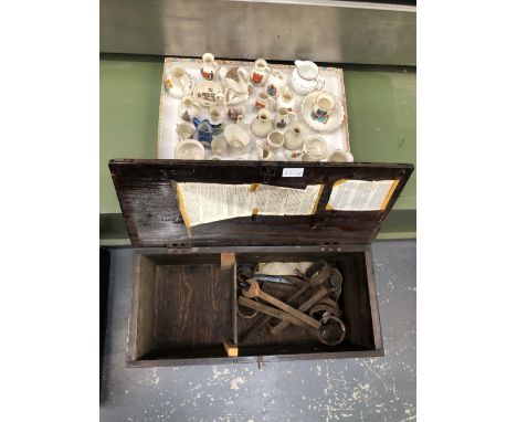 A WOODEN TOOL BOX WITH VINTAGE SPANNERS AND A QUANTITY OF GOSS WARE