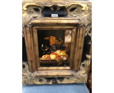 A PAIR OF STILL LIVES OF FRUIT, OIL ON PANEL AND IN GILT AND BLACK ELABORATE FRAMES.   55 x 47cms.