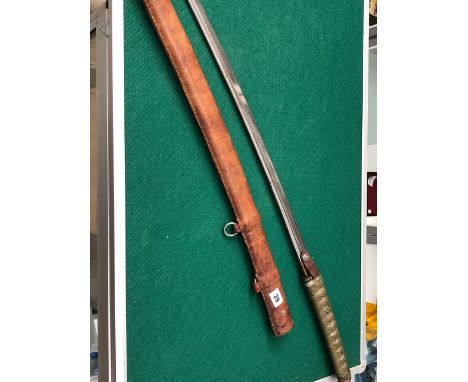 A VINTAGE JAPANESE KATANA SWORD IN LEATHER WRAPPED SCABBARD.