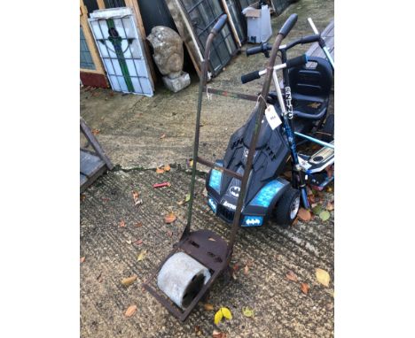 A VINTAGE CAST IRON ROTOVATOR WITH STONE ROLLER