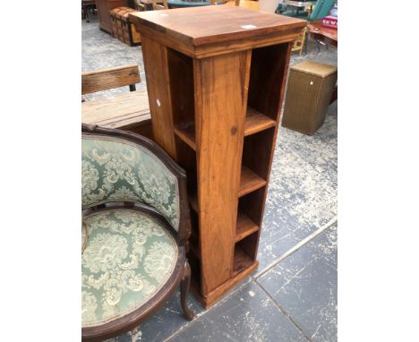 A CONTEMPORARY HARDWOOD PEDESTAL CD STAND