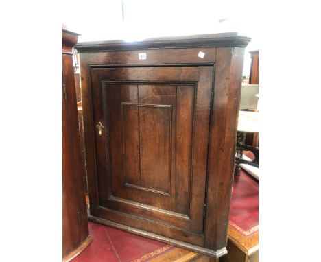 AN ANTIQUE COUNTRY MADE OAK HANGING PANEL DOOR CORNER CUPBOARD