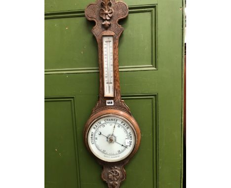 AN OAK BANJO CASED ANEROID BAROMETER WITH A MERCURY THERMOMETER