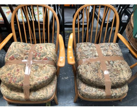 A PAIR OF ERCOL HOOP BACKED ARMCHAIRS