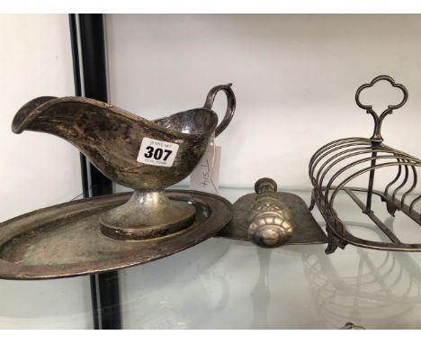 AN ELECTROPLATE SAUCE BOAT WITH FIXED STAND, TOAST RACK AND A CAKE TROWEL