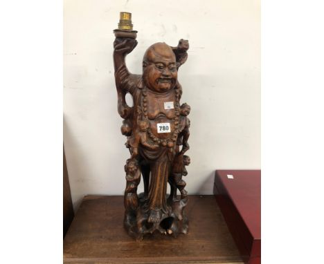 A CHINESE CARVED WOOD FIGURE OF BUDAI AS A LAMP