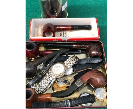 A COLLECTION OF VARIOUS WRIST WATCHES AND SMOKERS PIPES AND A VINTAGE MAX FACTOR PRINITIF SCENT AND CAT. 