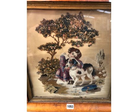 A VICTORIAN NEEDLEWORK PANEL OF A GIRL WITH HER PET DOG IN A MAPLE FRAME, TOGETHER WITH A LANDSCAPE WATERCOLOUR (2)