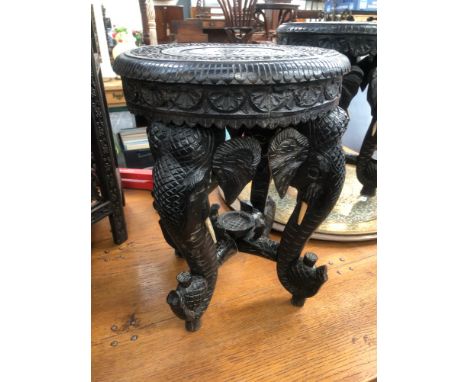 A PAIR OF INDIAN STOOLS WITH ELEPHANT TRUNK LEGS TOGETHER WITH TWO INDIAN BRASS DISHES
