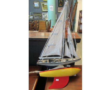 Vintage wooden model of a child's pond yacht marked 'Star Yacht', together with modern model of a sailing yacht. (2)(B.P. 21%