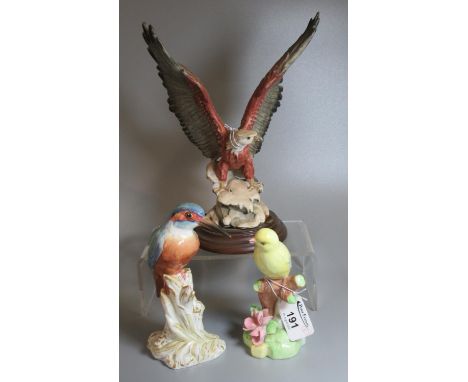Royal Worcester bone china 2666 Kingfisher on naturalistic stump, together with a Raybur English bone china study of another 