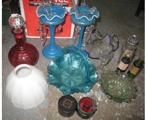 One box containing a cranberry glass decanter, two long stemmed, blue glass vases with crystal droppers, two epergne flutes, 