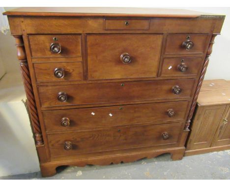 19th Century oak Scotch chest having an arrangement of four small and three long drawers on projecting base and bracket feet.
