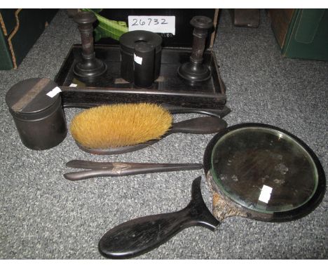 Ebonised dressing table set including brush, mirror, candle holders etc. (B.P. 21% + VAT) 