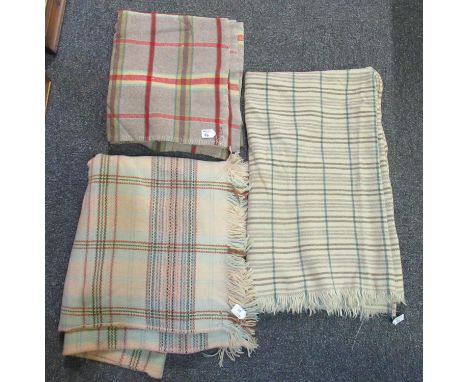 Three vintage woollen check blankets in various colours. One a narrow loom blanket. (3) (B.P. 21% + VAT)Brown and red check a