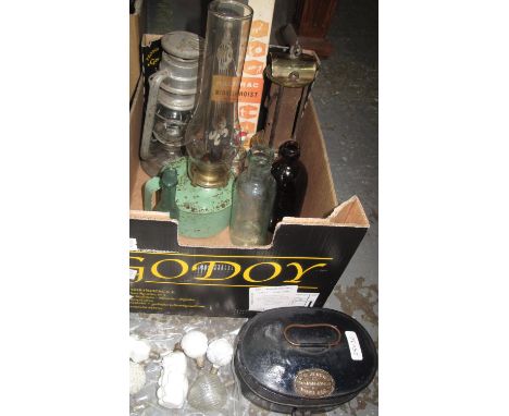 Box containing three vintage oil lamps, vintage bottles, a small hoist in a box, a charming vintage 'E.M Jenkins, ironmonger,